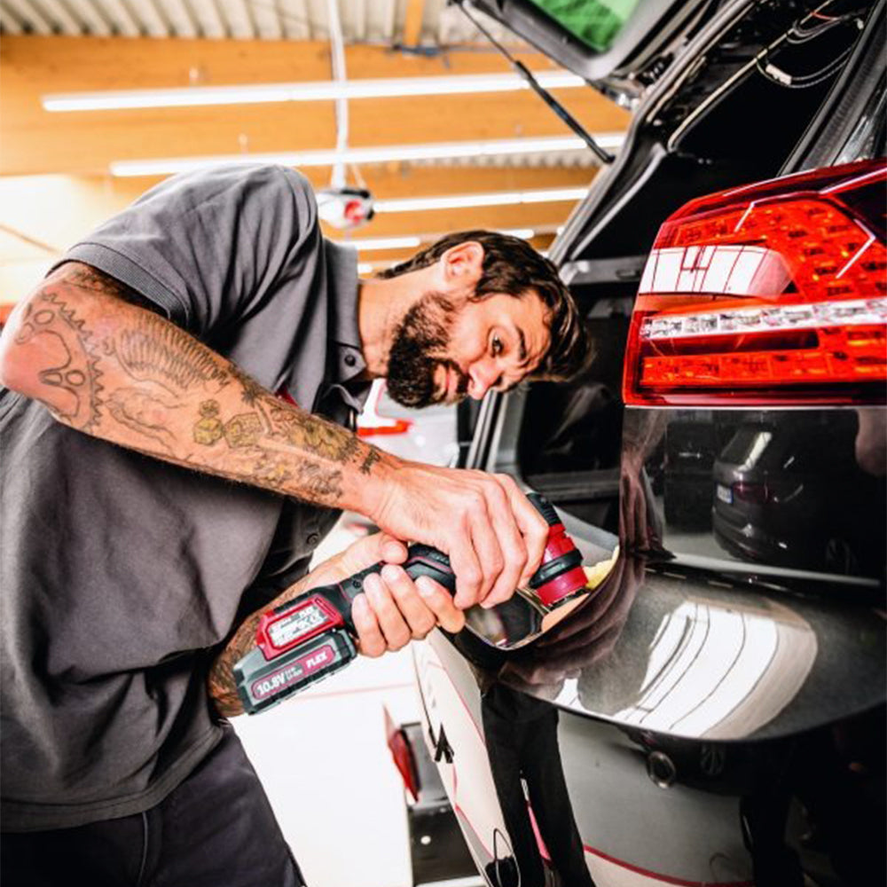 flex pxe 80 10.8-ec/2.5 set cordless machine polisher being used on a black car boot